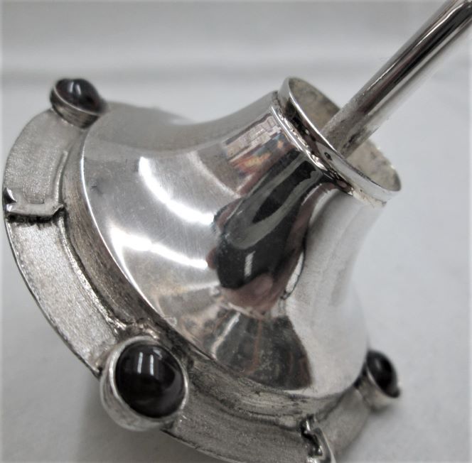 Chanukah Dreidel Silver Hematite in base sterling silver contemporary style UFO shape . Dreidel set with 4 Garnets & a Hematite by S. Ghatan.