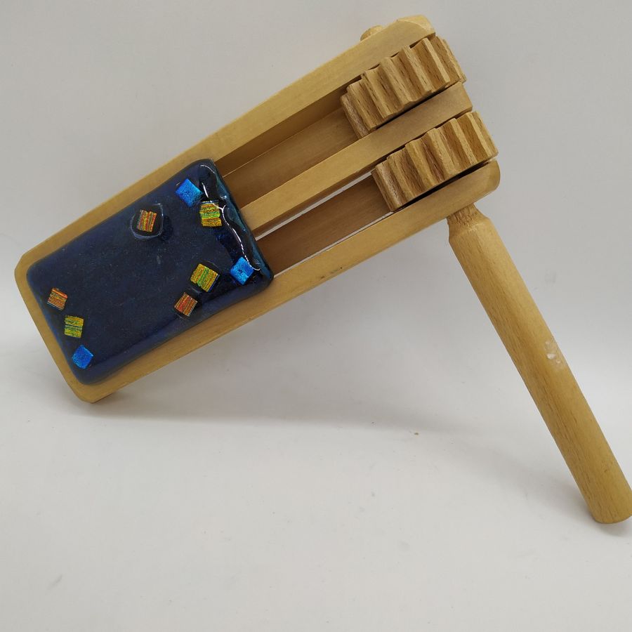 Purim Grogger fused glass and pine wood handmade multi dark colors dark blue and gold. Dimension 16 cm X 5.7 cm X 2.4 cm approximately.