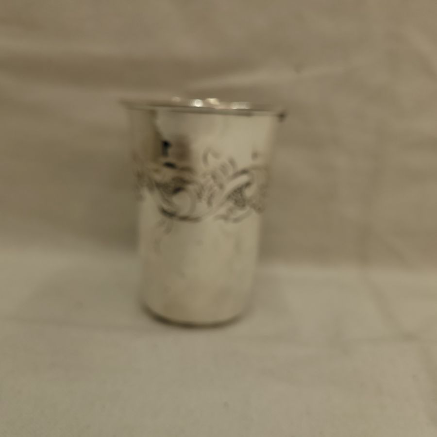 Handmade sterling silver Kiddush chalice floral engravings classic design around cup. Dimension diameter 6.6 cm X 9 cm approximately.