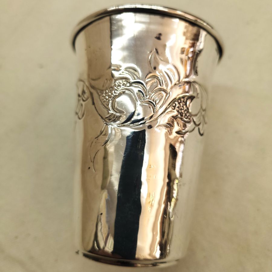 Handmade sterling silver Kiddush chalice floral engravings classic design around cup. Dimension diameter 6.6 cm X 9 cm approximately.