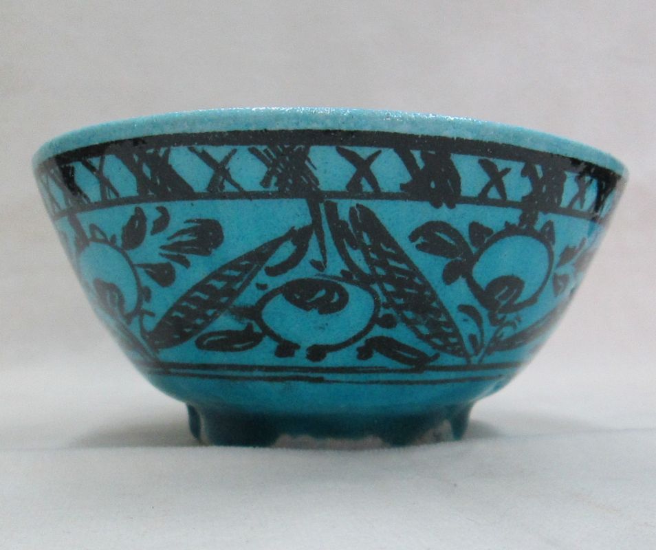 Glazed Ceramic Blue Bowl made of terracotta and blue Turquoise color with different fishes and floral designs.