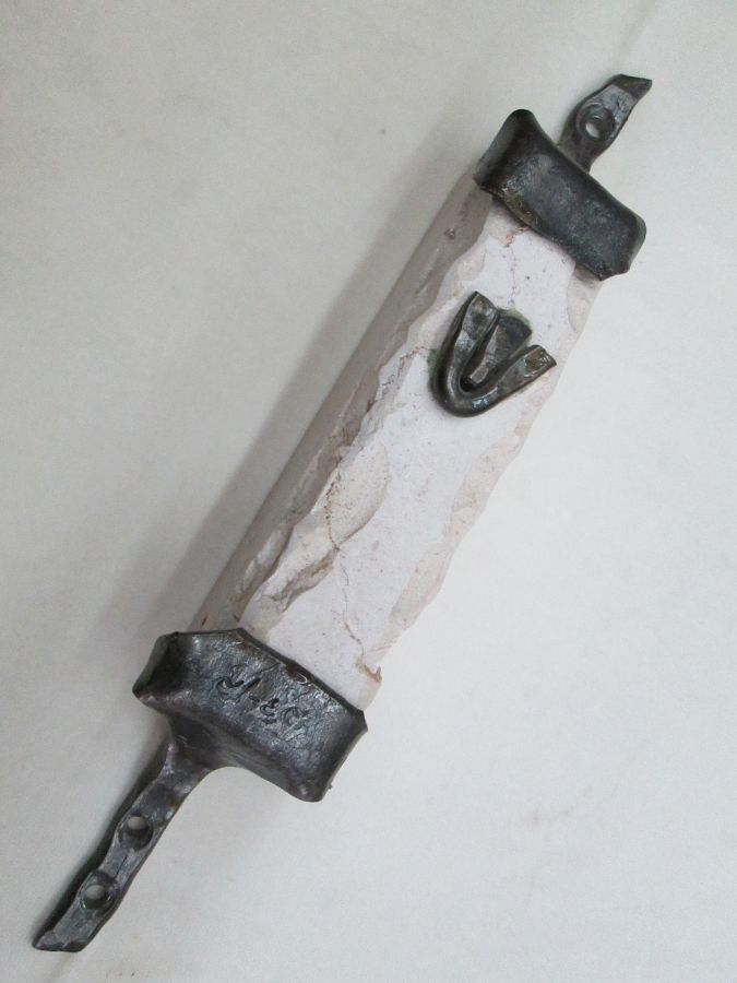 Contemporary Mezuzah Jerusalem carved stone with caste iron frame each Mezuzah is different because of the natural stone made by B. Dov.