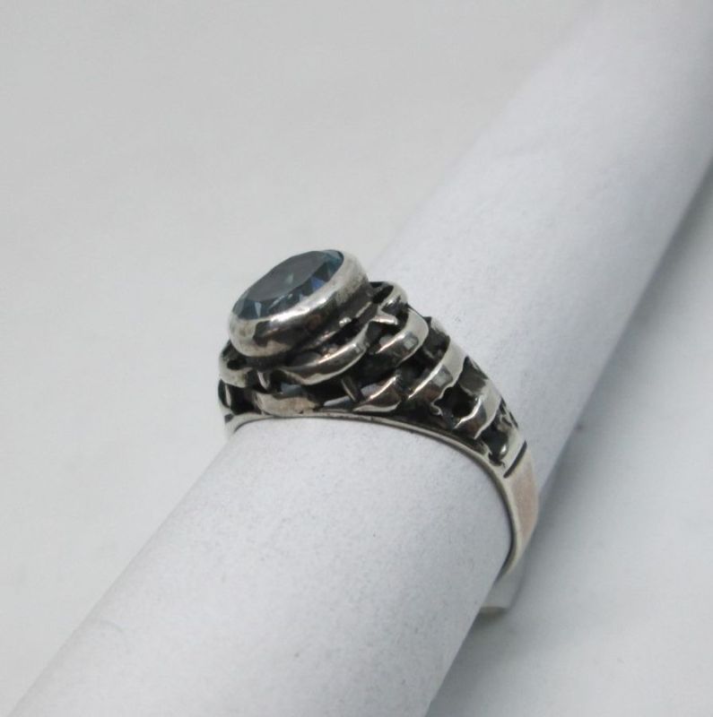 Handmade sterling silver blue Topaz ring contemporary style ring set with blue Topaz. Dimension 0.75 cm X 1.1 cm ring size 55.