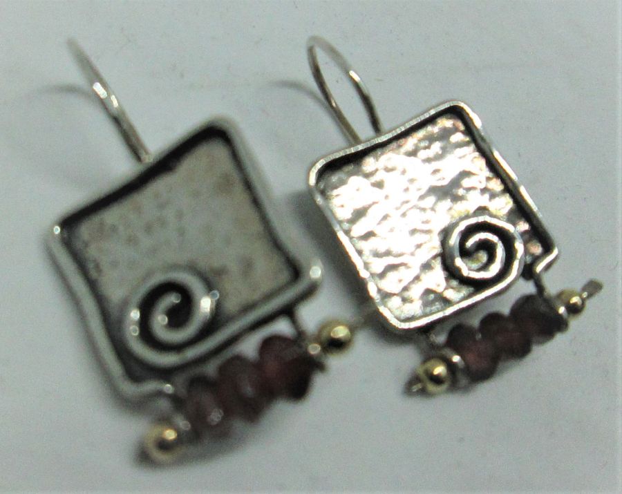 The hook in sterling silver earrings Garnets can not be changed to screw finding for non pierced ears. Dimension 1.5 cm X 1.9 cm approximately.