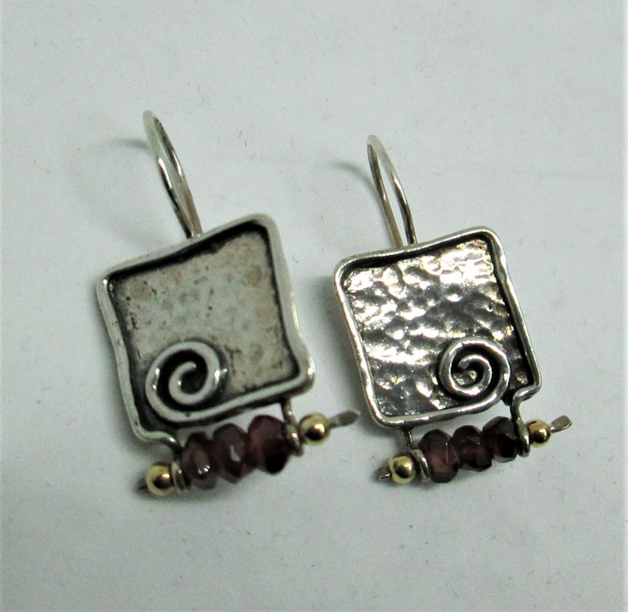 The hook in sterling silver earrings Garnets can not be changed to screw finding for non pierced ears. Dimension 1.5 cm X 1.9 cm approximately.