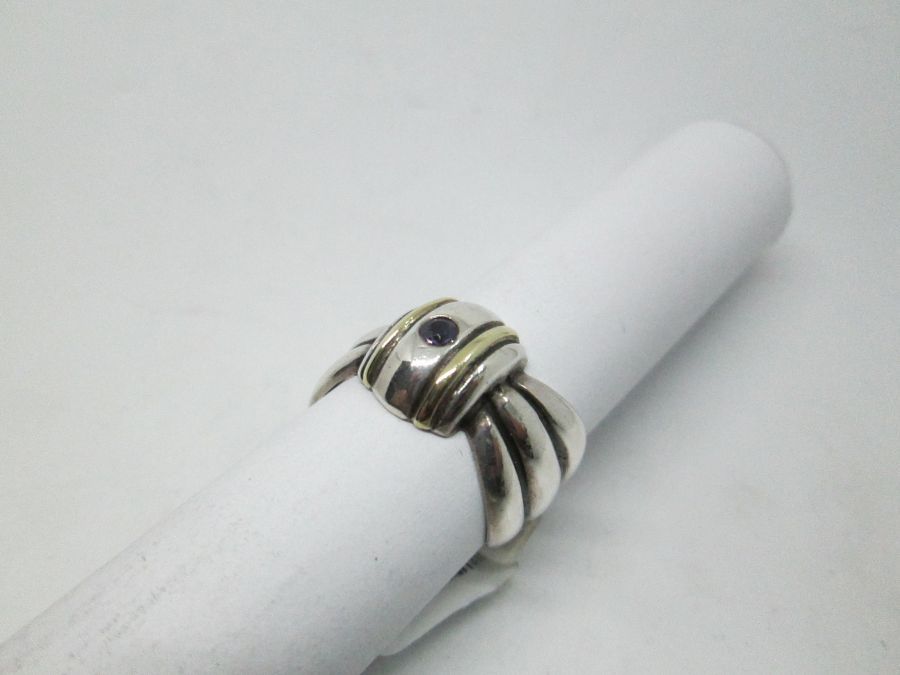 Handmade sterling silver & 14 carat gold contemporary style Amethyst gold silver ring set with Amethyst stone and tie ring shape.