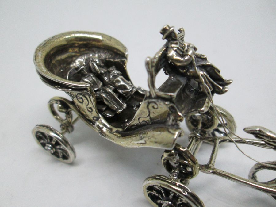 Handmade sterling silver miniature new wed carriage sculpture of new wed couple on a horse drawn wedding carriage 3.7 cm X 4.6 cm X 10.1 cm.