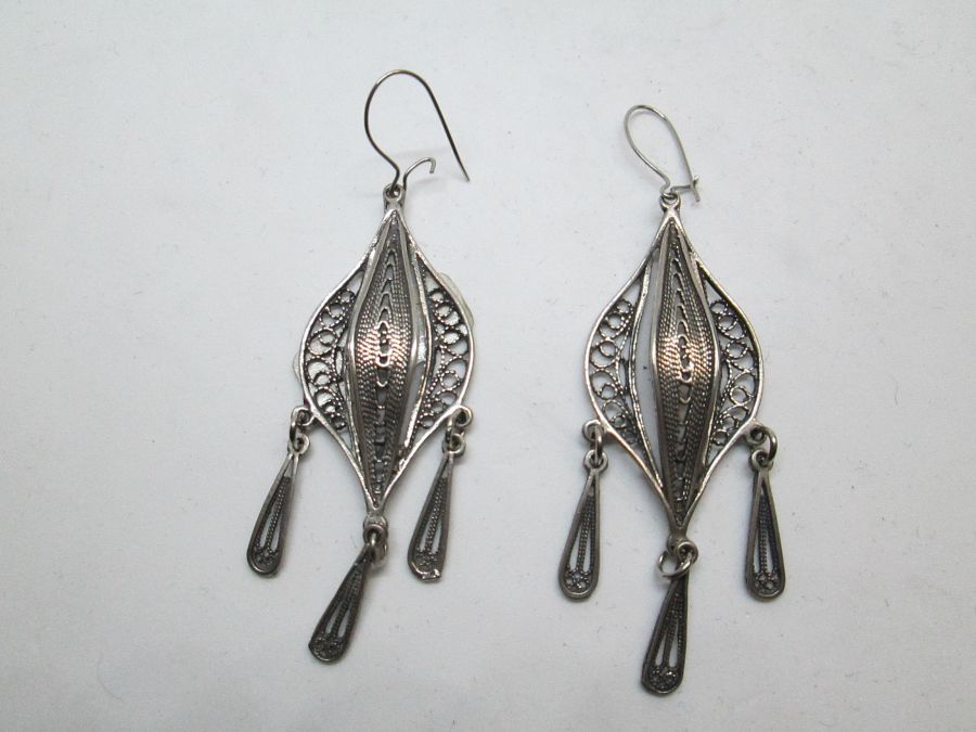 Handmade Yemenite filigree earrings with dangling drops Yemenite filigree. The hook can be changed to screw finding for non pieced ears by request.