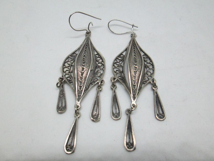 Handmade Yemenite filigree earrings with dangling drops Yemenite filigree. The hook can be changed to screw finding for non pieced ears by request.