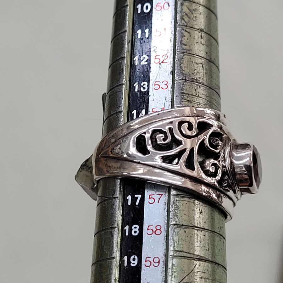 Handmade sterling silver cut out ring silver contemporary style ring set with faceted Garnet stone . Dimension 1.4 cm ring size 56.