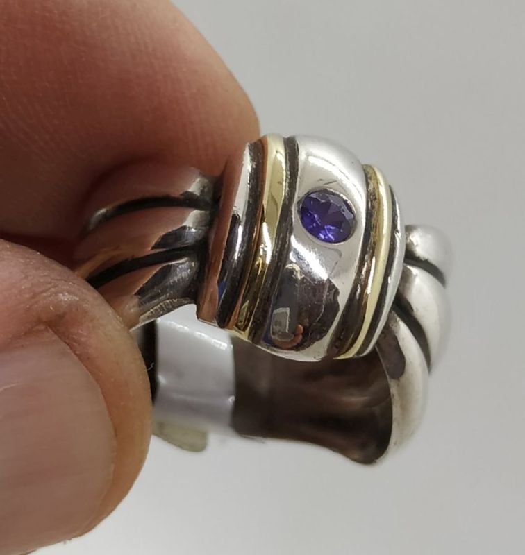 Handmade sterling silver & 14 carat gold contemporary style Amethyst gold silver ring set with Amethyst stone and tie ring shape.