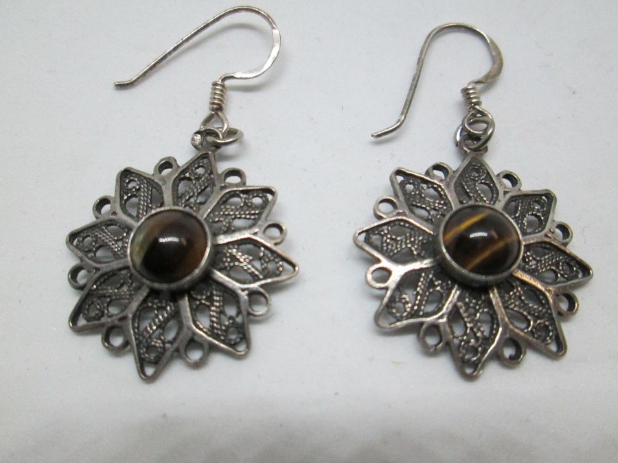 The hook in Yemenite filigree tiger eyes earrings can be changed to screw finding for non pieced ears by request. Dimension 1.8 cm X 5.4 cm approximately.