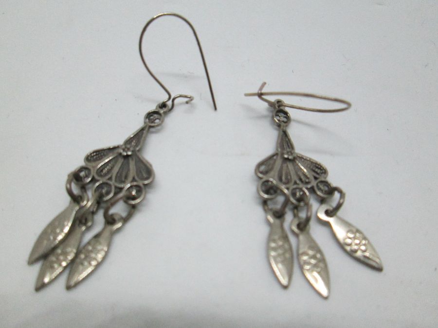 Sterling silver oxidized dangling Yemenite Filigree earrings with three hanging fishes. Dimension 1.7 cm X 5 cm approximately.