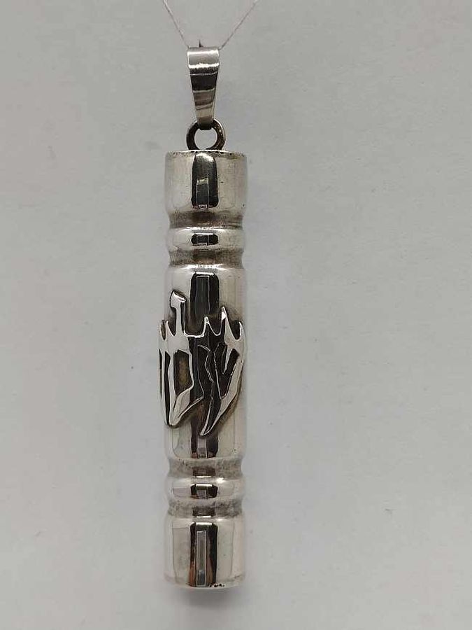 Handmade sterling silver Mezuzah pendant Shalom written Shalom in Hebrew on Mezuzah tube. Dimension diameter 1 cm X 5 cm approximately.