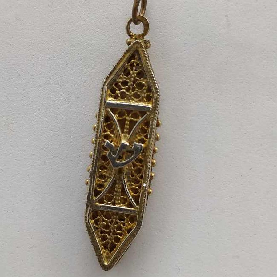 Sterling Silver Mezuzah pendant gold plated handmade with fine Yemenite filigree gold plated. Dimension 1 cm X 0.4 cm X 3.4 cm approximately.