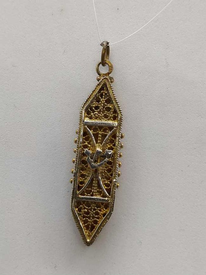 Sterling Silver Mezuzah pendant gold plated handmade with fine Yemenite filigree gold plated. Dimension 1 cm X 0.4 cm X 3.4 cm approximately.
