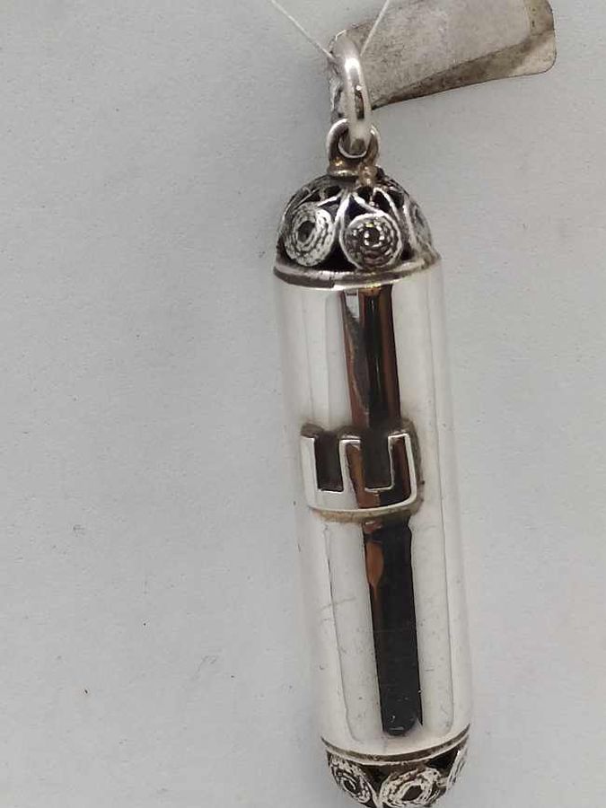 Sterling silver Mezuzah pendant filigree edges handmade by S. Ghatan(Katan) with Yemenite filigree edges up and down, diameter 1 cm X 4.1 cm approximately.