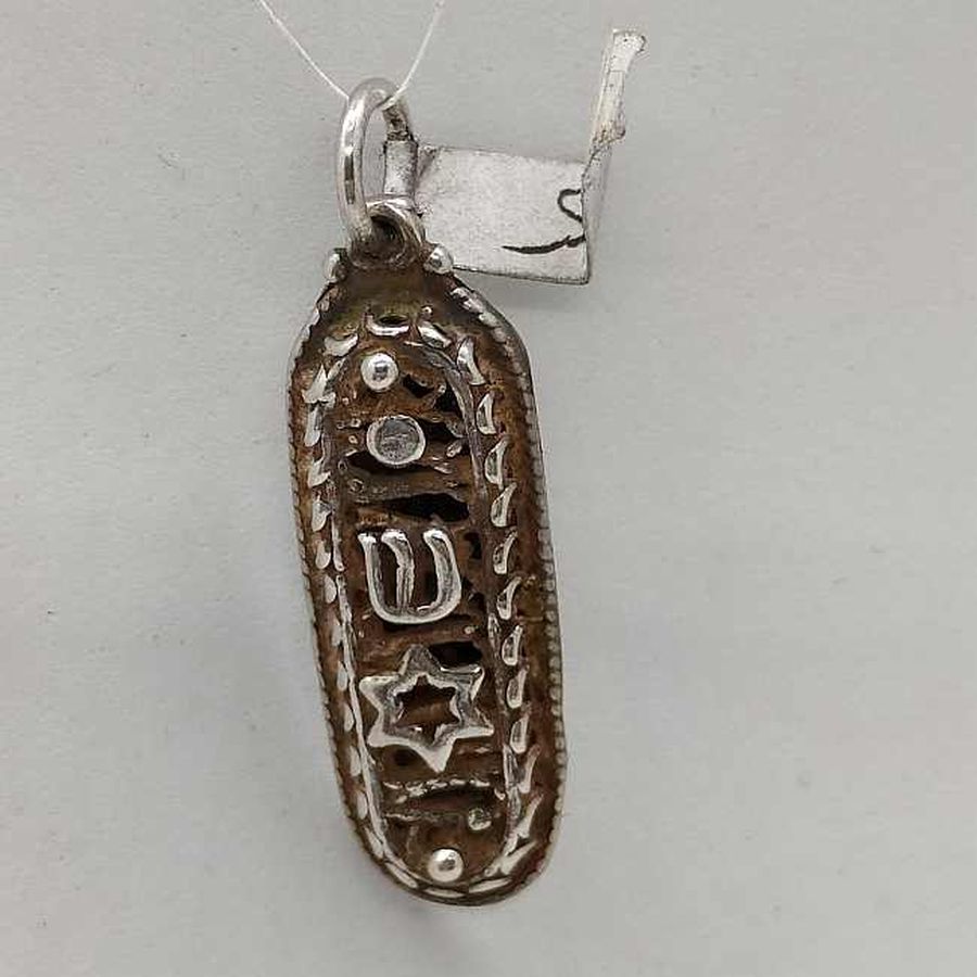 Handmade sterling silver Mezuzah pendant Magen David with Yemenite filigree & star of David on top. Dimension 1 cm X 0.4 cm X 2.7 cm approximately.