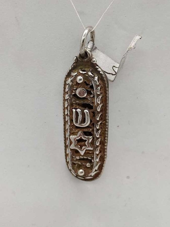 Handmade sterling silver Mezuzah pendant Magen David with Yemenite filigree & star of David on top. Dimension 1 cm X 0.4 cm X 2.7 cm approximately.