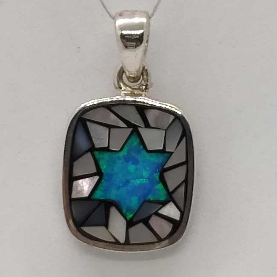 David star Opalite puzzle pendant is set with 1 Opalite stone & pieces of mother of pearl shaped in . Dimension 1.4 cm X 1.65 cm X 0.285 cm.