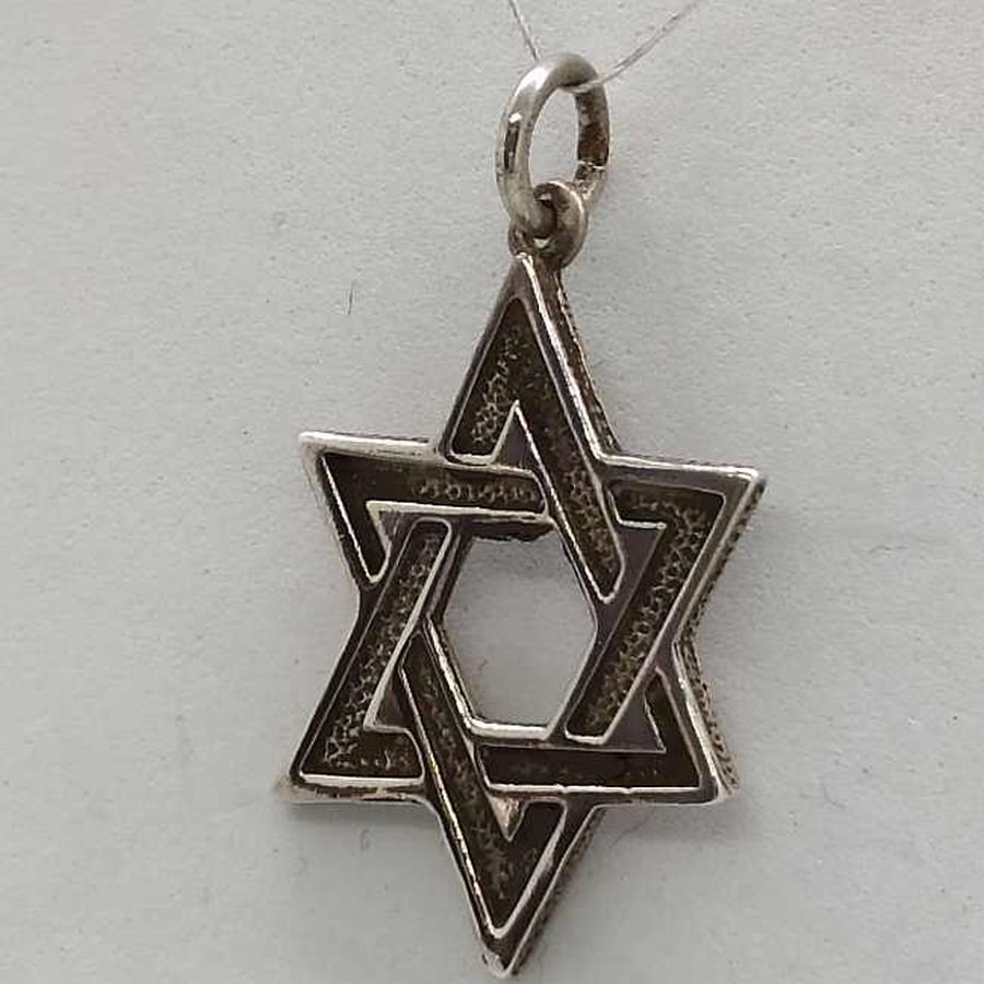 Handmade MagenDavid star uneven triangles with engravings handmade contemporary design. Dimension 2.25 cm X 1.7 cm X 0.15 cm approximately.