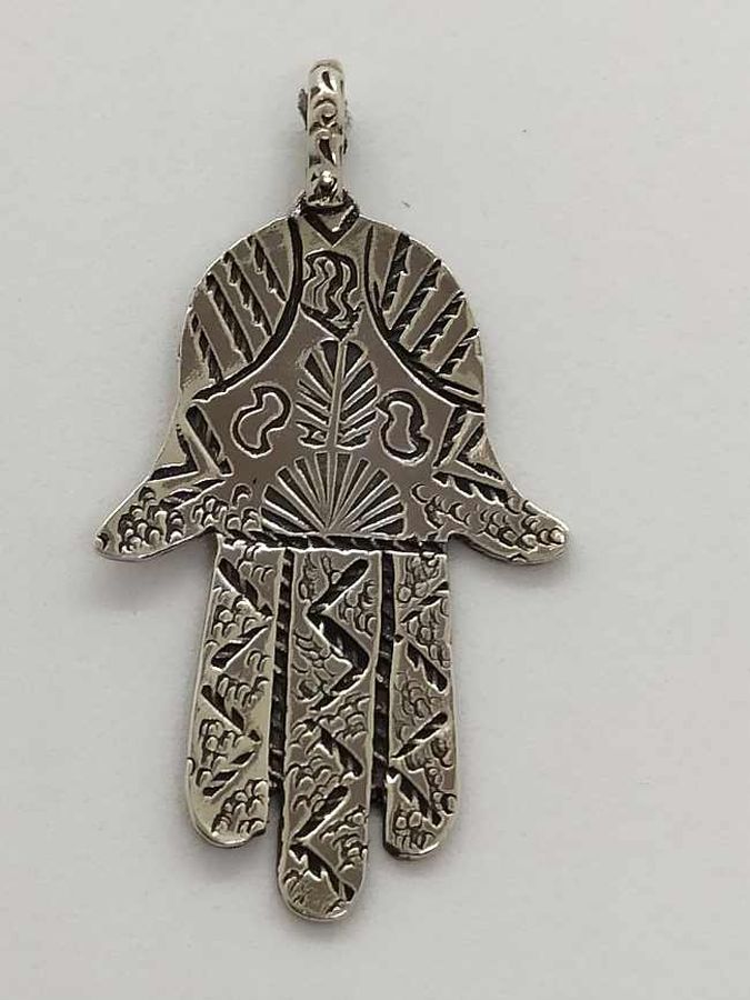 Handmade sterling silver Hamsa Chamsa pendant engravings designs on pendant. Dimension 2.3 cm X 3.6 cm X 0.1 cm approximately.