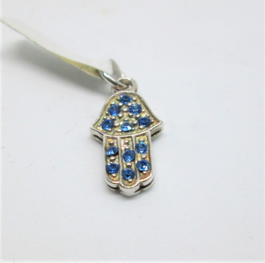 Handmade sterling silver Hamsa pendant blue crystals set with 12 blue crystal stones. Dimension 0.85cm X 1.3 cm X0.2 cm approximately.