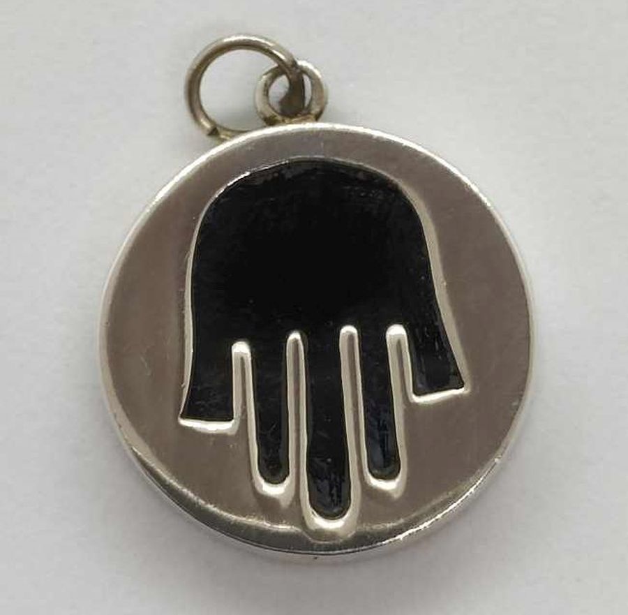 Handmade sterling silver Hamsa Chamsa pendant Onyx set with black Onyx stone cut out silver. Dimension diameter 2.2 cm X 0.4 cm approximately.