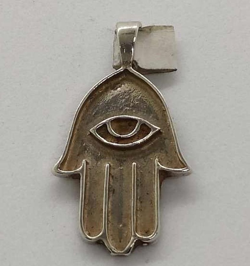 Handmade sterling silver Hamsa Chamsa pendant eye shape against evil in center. Dimension 1.6 cm X 2.3 cm X 0.5 cm approximately.