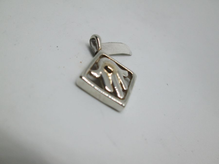 Handmade sterling silver Hamsa Chamsa pendant framed set with 14 carat gold dot and with square frame. Dimension 1.85 cm X 1.85 cm X 0.45 cm approximately.