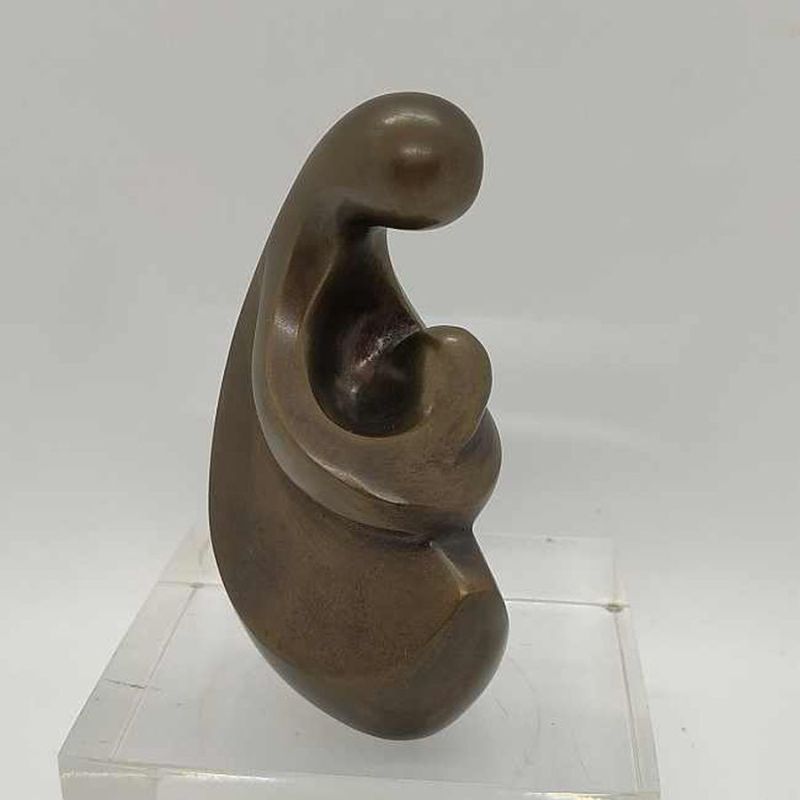 Bronze Sculpture Mother Baby in her lap handmade. Jaron has successfully expressed by metal smoothness warm feelings for child.