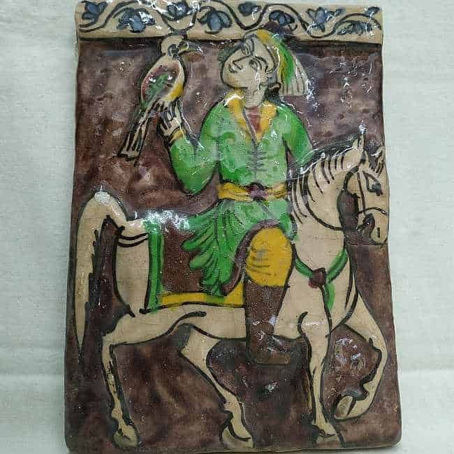 Glazed Ceramic Tile Vintage Horseman Training Falcon. Handmade glazed ceramic tile vintage made in Persia early 20th century. A horseman training his falcon