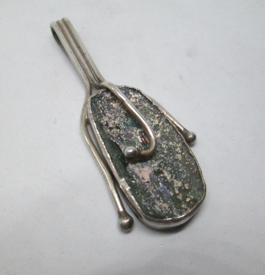 Handmade sterling silver pendant set with genuine Roman glass contemporary style. Dimension 2.2 cm X 5.7 cm approximately.