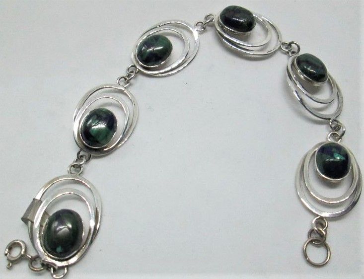Handmade sterling silver bracelet silver oval Azurite stones set with oval silver design. Dimension 1.6 cm X 18.8 cm approximately.