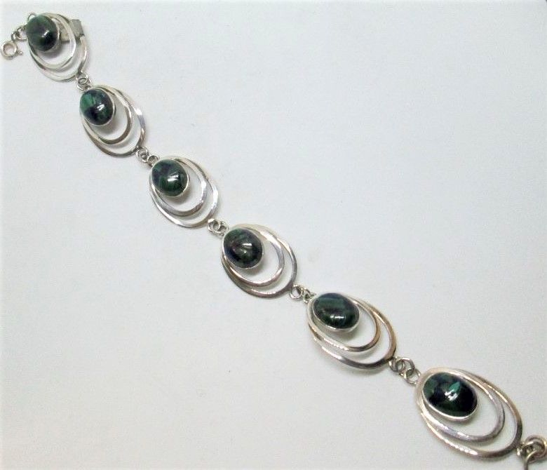 Handmade sterling silver bracelet silver oval Azurite stones set with oval silver design. Dimension 1.6 cm X 18.8 cm approximately.
