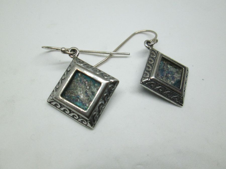 Handmade sterling silver earrings Yemenite filigree design square shape set with genuine Roman glass . Dimension 2 cm X 12 approximately.