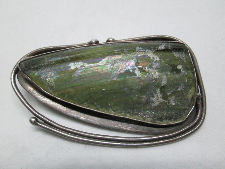Handmade sterling silver Roman glass brooch pendant set with genuine Roman glass. Dimension 3.1 cm X 5.1 cm approximately.