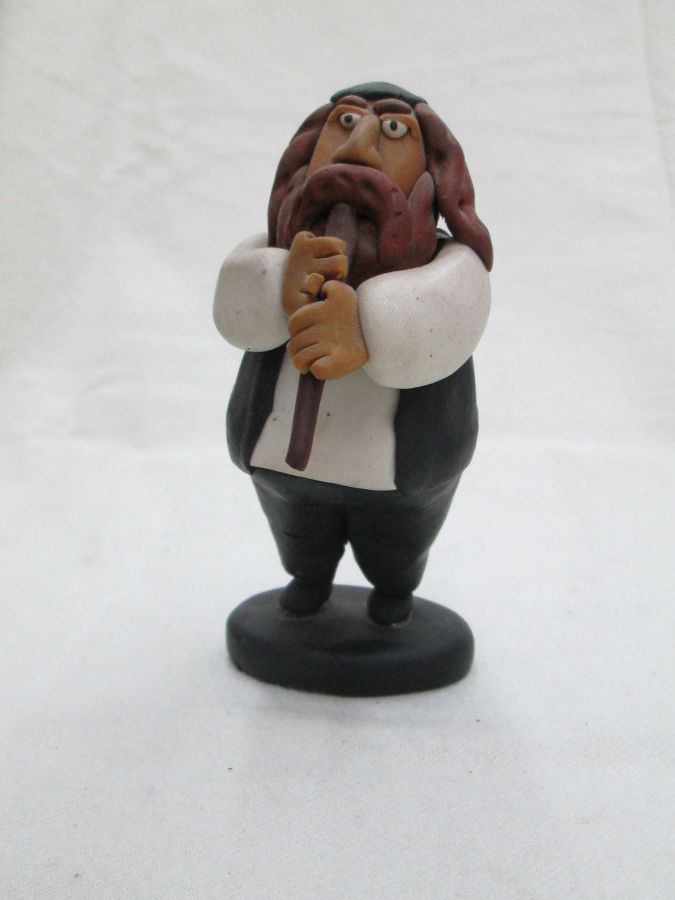 Handmade humoristic fimo ceramic a Shabby Rabbi playing flute made by Yuri. Dimension 10.7 cm X 5.8 cm X 4.2 cm approximately.