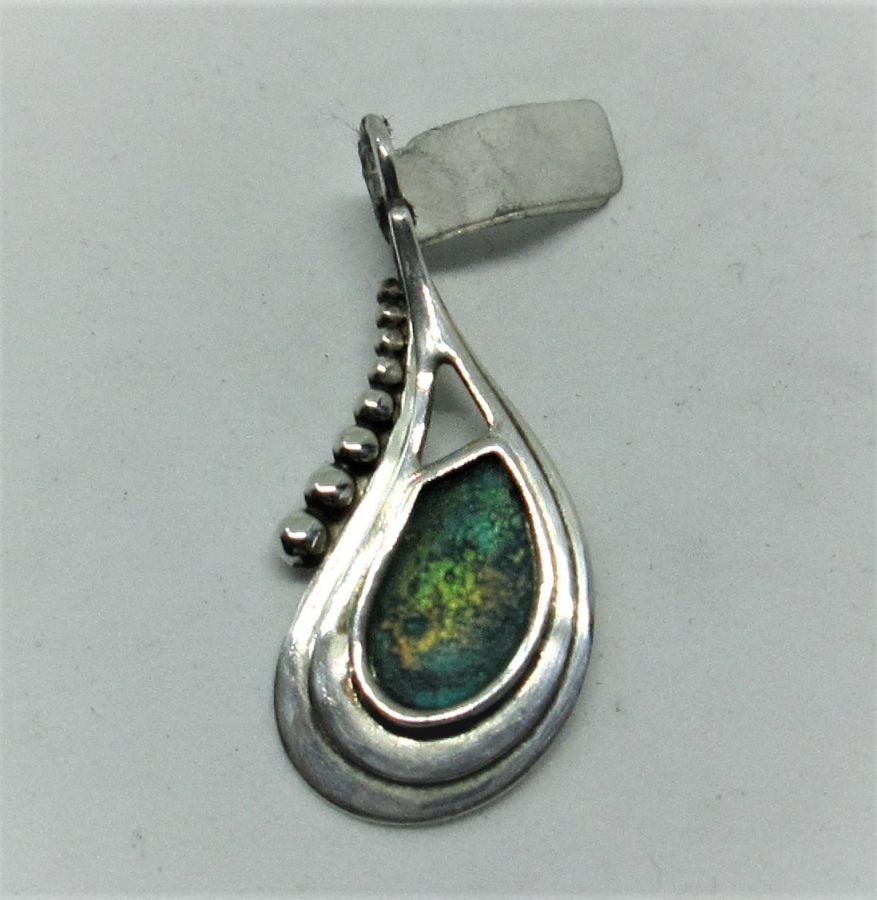 Handmade sterling silver Roman glass silver pendant set with genuine green Roman glass. Dimension 1.4 cm X 2.8 cm approximately.