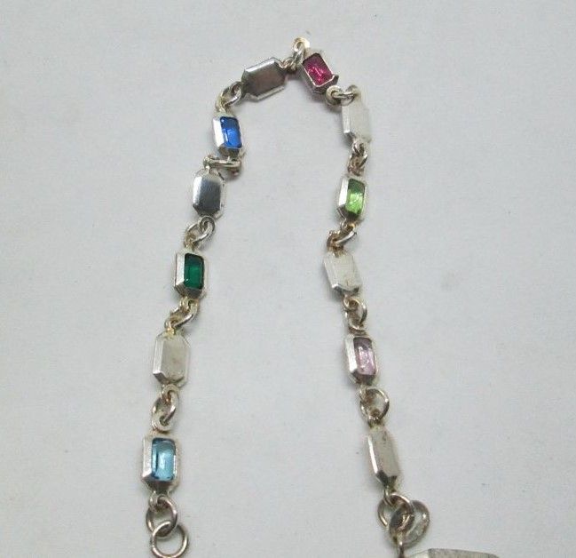 Handmade sterling silver bracelet multi colors stones with faceted colored Zirconia stones. Dimension 0.5 cm X 19.5 cm approximately.