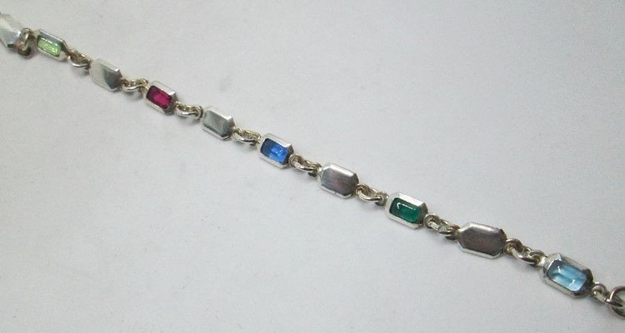 Handmade sterling silver bracelet multi colors stones with faceted colored Zirconia stones. Dimension 0.5 cm X 19.5 cm approximately.