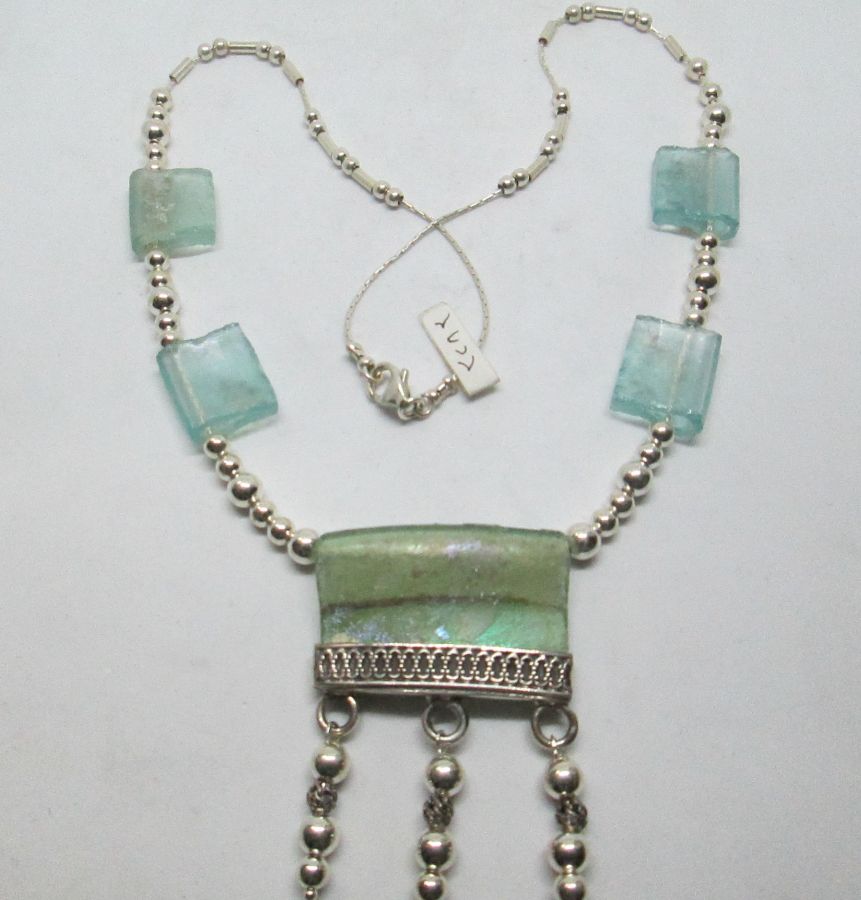 Handmade sterling silver Roman glass necklace set with genuine Roman glass Yemenite filigree. Dimension 3.3 cm X 4.7 cm approximately.