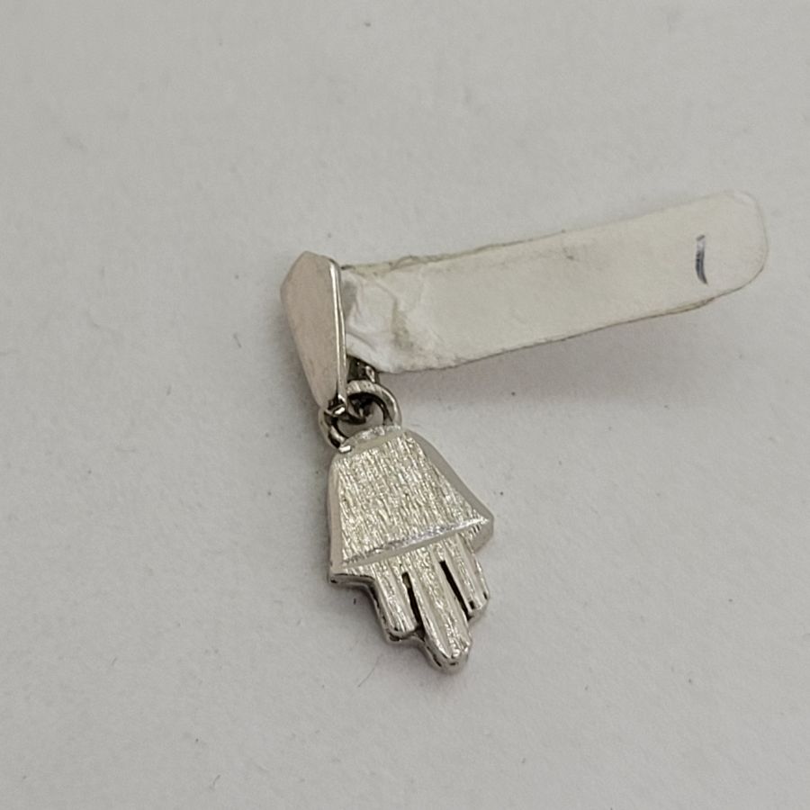 Handmade mini Hamsa heavy white solid 14 gold with Florentine brush finish. Dimension 0.75 cm X 1.1 cm X 0.2 approximately.