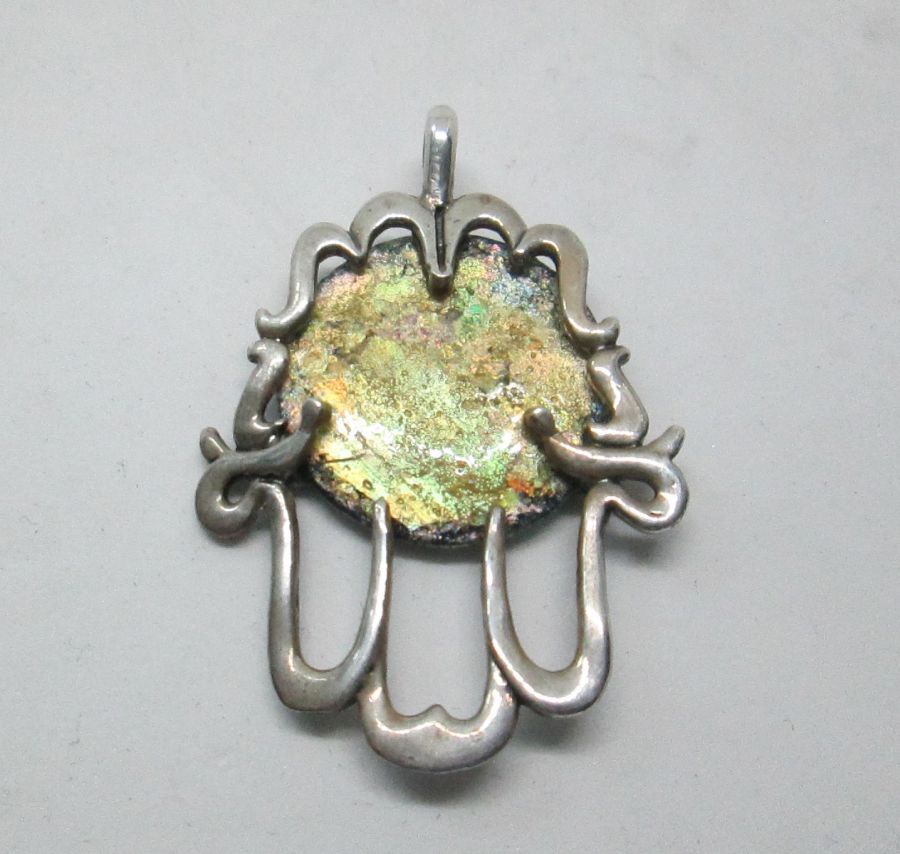 Handmade sterling silver Hamsa Roman glass Chamsa pendant set with genuine Roman glass abstract design. Dimension 2.8 cm X 3.4 cm approximately.