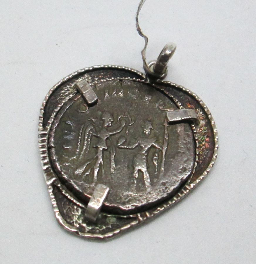 Silver Pendant Heart Shape set with coin. Sterling silver pendant heart shape set with genuine antique Roman coin from the fifth century AD.