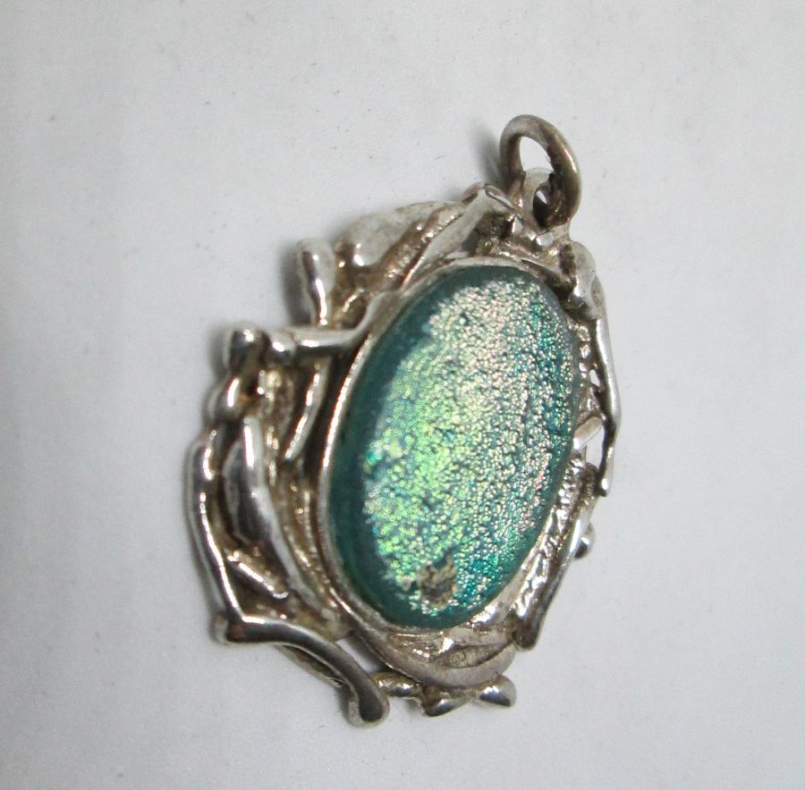 Handmade sterling silver Abstract Roman Glass pendant set with genuine Roman glass contemporary style. Dimension 2.9 cm X 3.4 cm approximately.