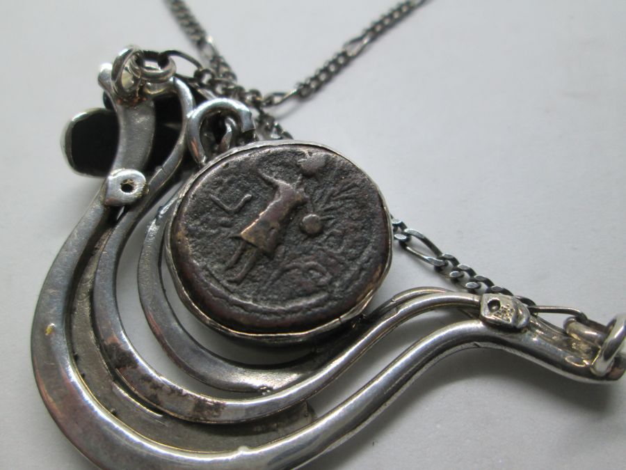 A contemporary design of dove shape necklace silver antique coin set with genuine antique Roman coin 1st century BC. dove 5.2 cm X 3.3 cm X 56 cm.
