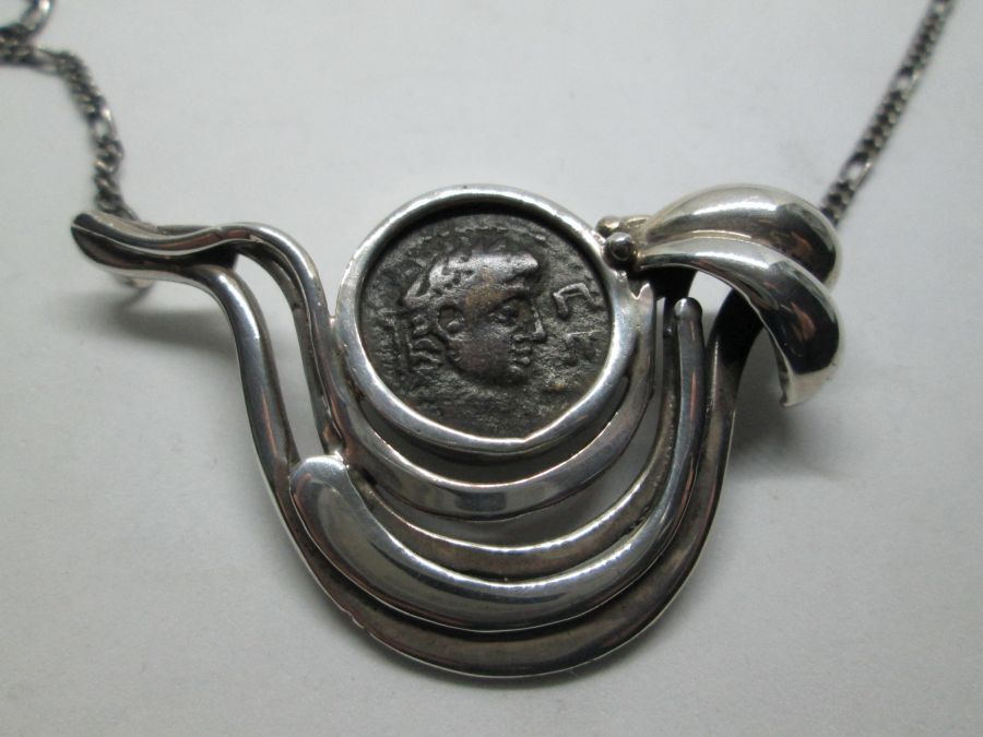 A contemporary design of dove shape necklace silver antique coin set with genuine antique Roman coin 1st century BC. dove 5.2 cm X 3.3 cm X 56 cm.