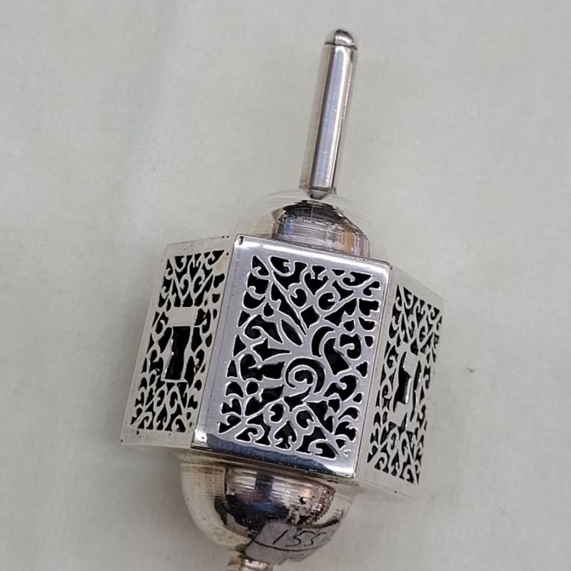 Handmade sterling silver cut out dreidel hexagon shape cut out designs. Dimension 3.3 cm X 3.7 cm X 7.5 cm approximately.