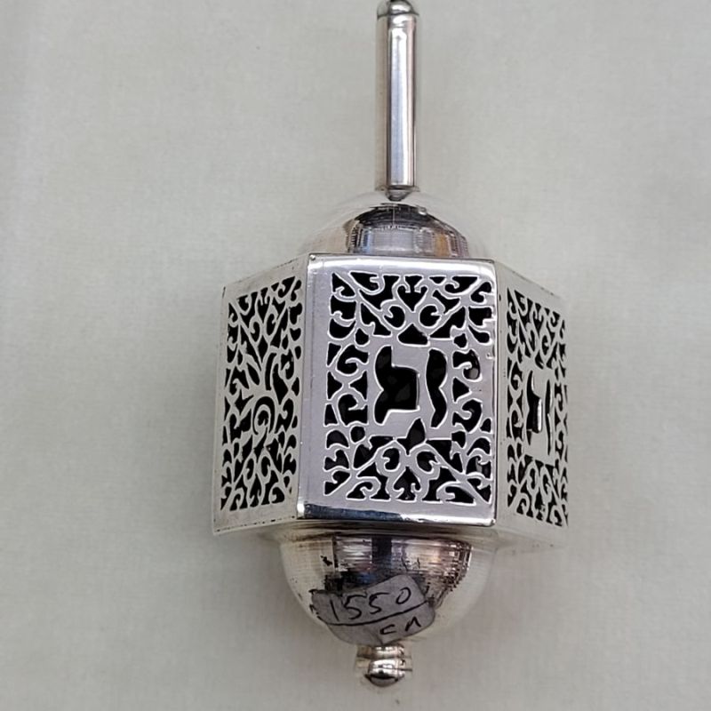 Handmade sterling silver cut out dreidel hexagon shape cut out designs. Dimension 3.3 cm X 3.7 cm X 7.5 cm approximately.